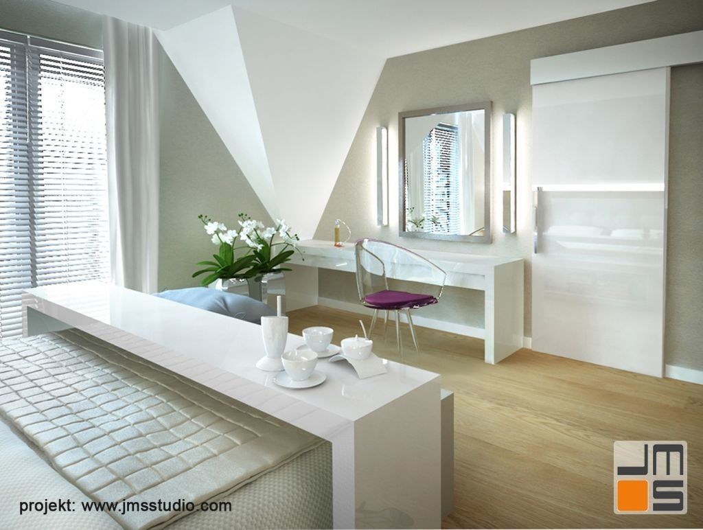 Toaletka z dużym lustrem i podświetleniem LED dopełnia projekt sypialni.