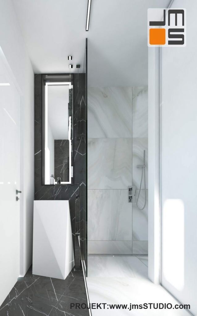 łazienka w apartamencie z nowoczesna asymetryczna umywalką i marmurem