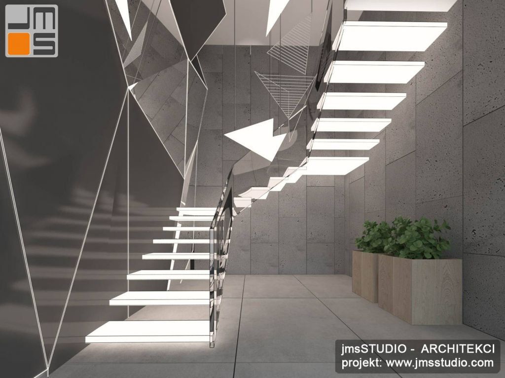 Projekt designerskich wnętrz klatki schodowej i schodów w dużym domu jednorodzinnym z betonem architektonicznym w projekcie wnętrza oraz stalowymi schodami